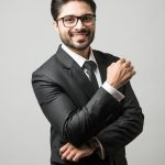 portrait of indian male businessman standing over white background premium photo